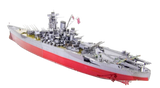 Assembled metal model of a Yamato Battleship with red hull on a white background