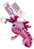 A string doll of a pink axolotl with blue eyes. Its tag reads "Axolotl."