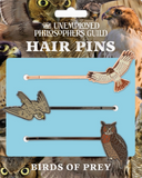 Hair pins of a hawk, a falcon, and an owl.