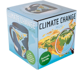 The box for the climate change mug. It is blue with an image of some countries in the middle of it. The countries are colored in orange, yellow, and green. There is a magnifying glass over part of the countries. The box reads, "Climate change mug" on the top. On the bottom, it states, "Farewell, Florida." On the other side of the box, it shows the mug, blue with countries on it. On the corner, it states "Add hot water, sea levels rise, and coastlines disappear."