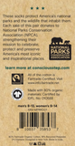 The back of a tag. It reads, "These socks protect America's national parks and the wildlife that inhabit them. Each sale of this pair donates to National Parks Conservation Association (NPCA), strengthening their mission to celebrate, protect and preserve America's most iconic and inspirational places."