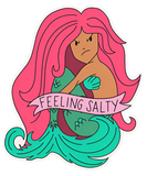 Mermaid sticker with banner reading "feeling salty" across torso. Mermaid has pink hair, green tail and tan skin.