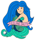 Mermaid sticker with banner reading "feeling salty" across torso. Mermaid has blue hair, green tail and light skin.
