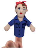 A finger puppet of Rosie the Riveter being held up by someone's finger. She has pale skin, brown hair, a red and white polka-dotted headband, blue eyes, red lipstick, and a blue shirt.