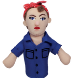 A finger puppet of Rosie the Riveter. She has pale skin, brown hair, a red and white polka-dotted headband, blue eyes, red lipstick, and a blue shirt.