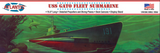 A box for a model ship called the, "USS Gato Fleet Submarine." There is an illustration of a submarine submerged in green and blue water on the cover. There is a shark swimming next to the submarine and some coral around the sides.