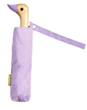A lilac umbrella with a duck head at the top of the pole with a lilac beak.