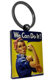 A keychain with Rosie the Riveter. She has on her iconic red and white spotted headband and blue shirt on, while holding out her arm with her fist clenched. There is a blue text bubble above her that says in white text, "We Can Do It!"