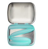 A silicone straw inside a tin. The straw is mint blue and folded up inside the tin.