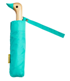 A light blue umbrella with a duck head at the top of the pole with a light blue beak.