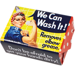 Soap that has Rosie the Riveter on it. She is in her iconic red and white polka dotted headband and blue shirt. She is in a shower getting wet and holding a bar of soap. There is a blue textbox next to her that says, "We Can Wash It!" Underneath that it says, "Removes elbow grease." There is text on the side of the soap packaging that says, "Don't be afraid to get your hands dirty."