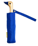 A blue umbrella with a duck head at the top of the pole with a blue beak.