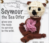A string doll of a sea otter. It has a tan face with black eyes, nose, and mouth, and brown ears and body. It is holding some coral. Text on the side states, "Seymour the Sea Otter gives you the tools to survive in the wild."