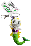 A string doll of a mermaid. She has yellow hair, pale skin, a purple bra, and a green tail. A tag on her states that her name is, "Shelly."