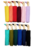 An assortment of umbrellas in various different colors. Each one has a duck head on the pole.