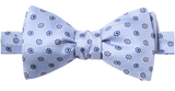 A baby blue bow tie with illustrated ship wheels repeated on it.