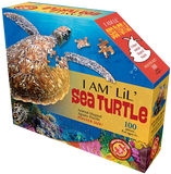 A puzzle box with text that says, "I Am Lil' Sea Turtle. Animal-shaped jigsaw puzzle. Poster size! 100 pieces. For ages 5+." There is a picture of a sea turtle on the side of the box with puzzle pieces coming out of it.
