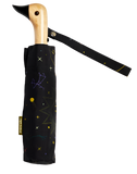 A black umbrella with constellations, suns, and moon with a duck head on top of the pole with a black beak.