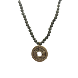 Necklace with jade beads and a gold coin pendant with Chinese characters
