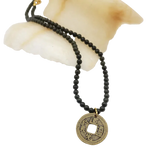 Necklace with jade beads and a gold coin pendant with Chinese characters