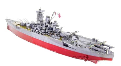 Assembled metal model of a Yamato Battleship with red hull on a white background