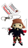 A string doll of the pirate black beard. He has a brown captain's hat, a long black beard, a red coat, brown pants, red socks, and black shoes with a silver buckle. He is holding a wire sword and gun. His tag reads that his name is "Blackbeard."