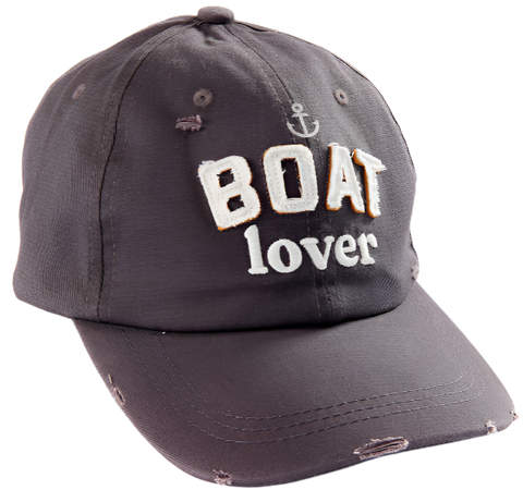 A brown hat that says "Boat lover" in the center in white fabric. There is a small anchor above the text. Parts of the hat are slightly destressed. 