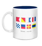 White mug with colorful signal flags and text 'boat nerd' on a white background
