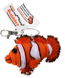 String doll of a clownfish. It is an orange fish with white stripes, and the stripes have a black outline. It has a tag that states that its name is "Bubbles."