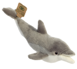 A plush dolphin with a fuzzy grey and white body, and black and brown eyes. It has a tag on its fin that reads, "Eco nation."