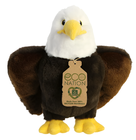 A plush eagle with a white face, yellow beak, yellow and black eyes, a brown body, and yellow feet. It has a tag around its neck that reads, "Eco nation. Made from 100% recycled materials." 