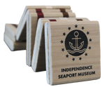 A wooden Jacob's ladder toy that has the text "Independence Seaport Museum" on it, along with the logo of an anchor on a wave encased in a circle and surrounded by stars.