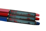 Three pens with floating pictures inside of them of a person kayaking in Philadelphia. There are buildings from Philadelphia in the background, as well as logos of the Liberty Bell, Rocky, and the Love sign. Two pens are red, and one is blue. 