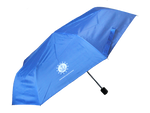 A light blue umbrella with ISM's logo which is an anchor sitting on a wave encompassed by a circle that is surrounded by stars. Underneath the logo, there is text that reads, "Independence Seaport Museum." 