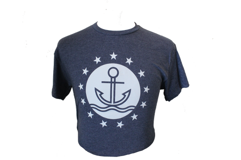 A navy-blue shirt with the ISM logo, which is an anchor sitting on a wave encompassed by a circle that is surrounded by stars.