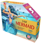 A puzzle box with text that says, "I Am Mermaid. Mermaid-shaped jigsaw puzzle. Poster size! 1000 pieces. For ages 12+." There is a picture of a mermaid on the side of the box with puzzle pieces coming out of her. She is holding a shell next to her head.