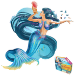 A puzzle that is shaped like a mermaid holding a shell. There are puzzle pieces missing from it and some pieces next to her head. Next to it is a puzzle box with text that says, "I Am Mermaid. Mermaid-shaped jigsaw puzzle. Poster size! 1000 pieces. For ages 12+." There is a picture of a mermaid on the side of the box with puzzle pieces coming out of her. 