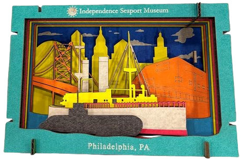 Pop-up cityscape model of Philadelphia with colorful buildings and a ship, featuring 'Independence Seaport Museum' branding.