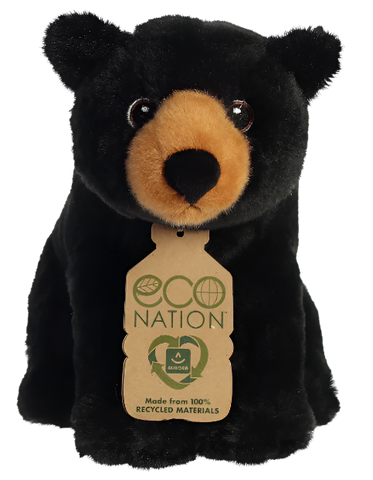 A small black bear plushie with black and brown eyes and a brown snout. His tag reads "Eco nation. Made from 100% recycled materials." 