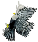 Decorative eagle hair clip with yellow accents.