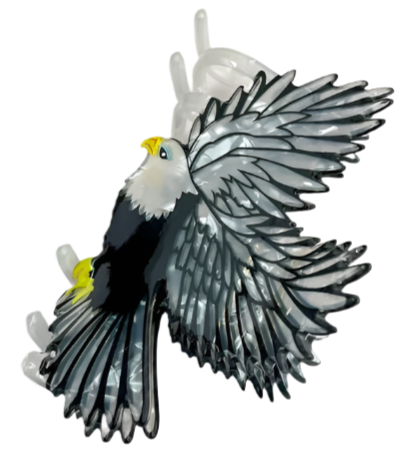 Decorative eagle hair clip with yellow accents.