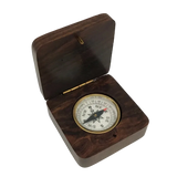 Wooden compass case with a compass inside 