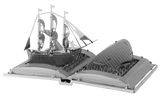 Metal model of a ship on an open book 