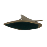 Bottom view of bronze sailboat paperweight and green felt bottom
