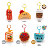Collection of plush toys shaped like food items with labels on a white background