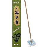 Green tea incense packaging with a single incense stick in a blue and white floral holder.