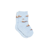 A pair of toddler light blue ankle socks with a pattern of otters floating on rings of water, featuring white grip dots on the soles,
