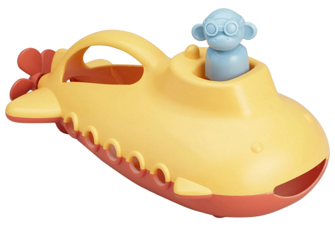 Yellow toy submarine with a blue monkey figure on a white background
